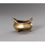 A MINIATURE BRONZE TRIPOD CENSER, QING DYNASTY