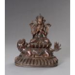 A BRONZE GUANYIN AND LION GROUP, 20TH CENTURY