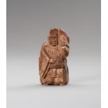 A KIRI (PAULOWNIA) WOOD NETSUKE OF A SAMBASO DANCER