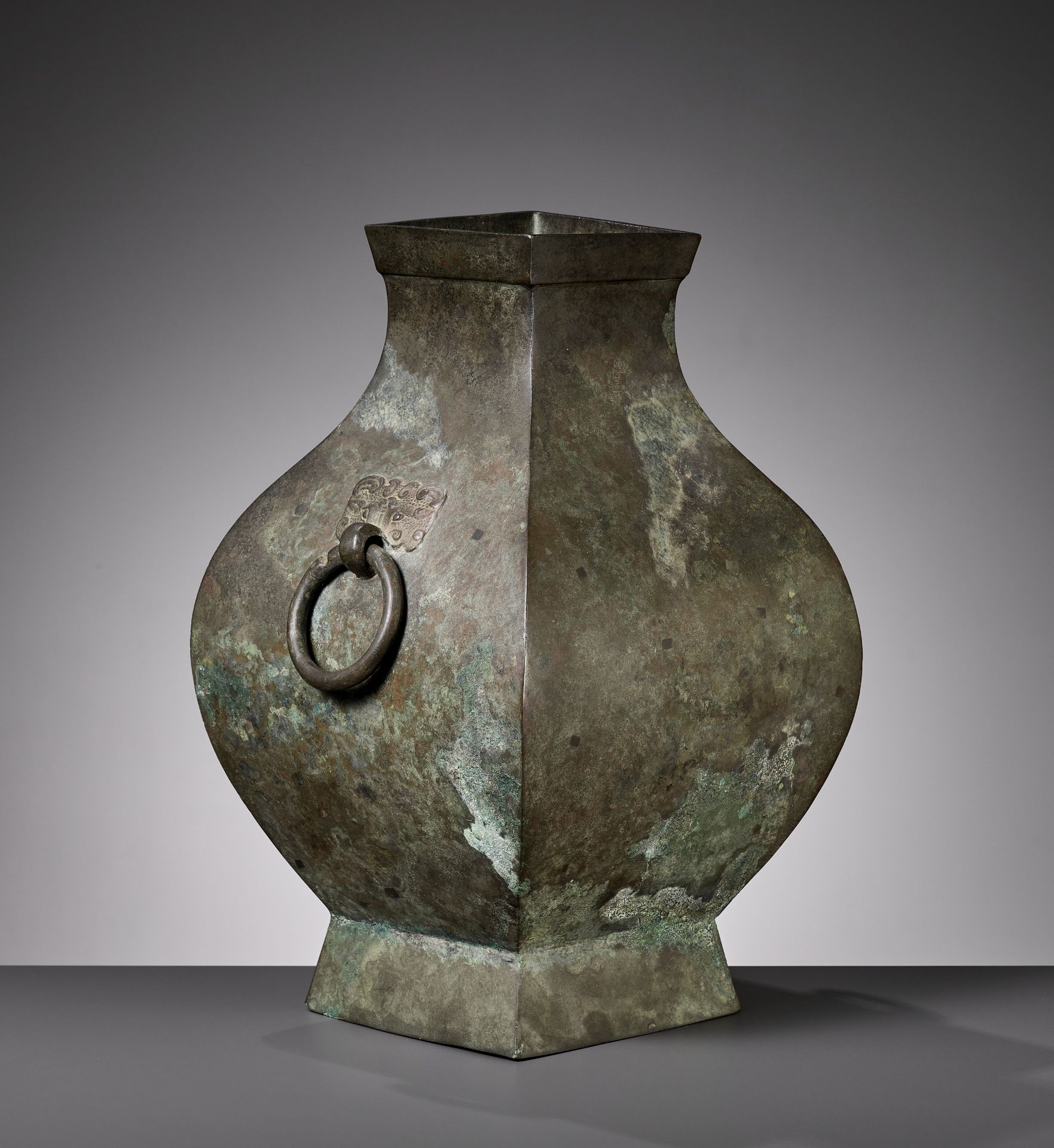 A BRONZE STORAGE VESSEL, FANGHU, HAN DYNASTY