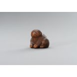 RIMU: A WOOD NETSUKE OF A PUPPY