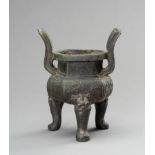 A HEAVILY CAST ARCHAISTIC BRONZE TRIPOD CENSER, QING DYNASTY