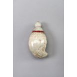 A MUGHAL-STYLE STONE PERFUME BOTTLE