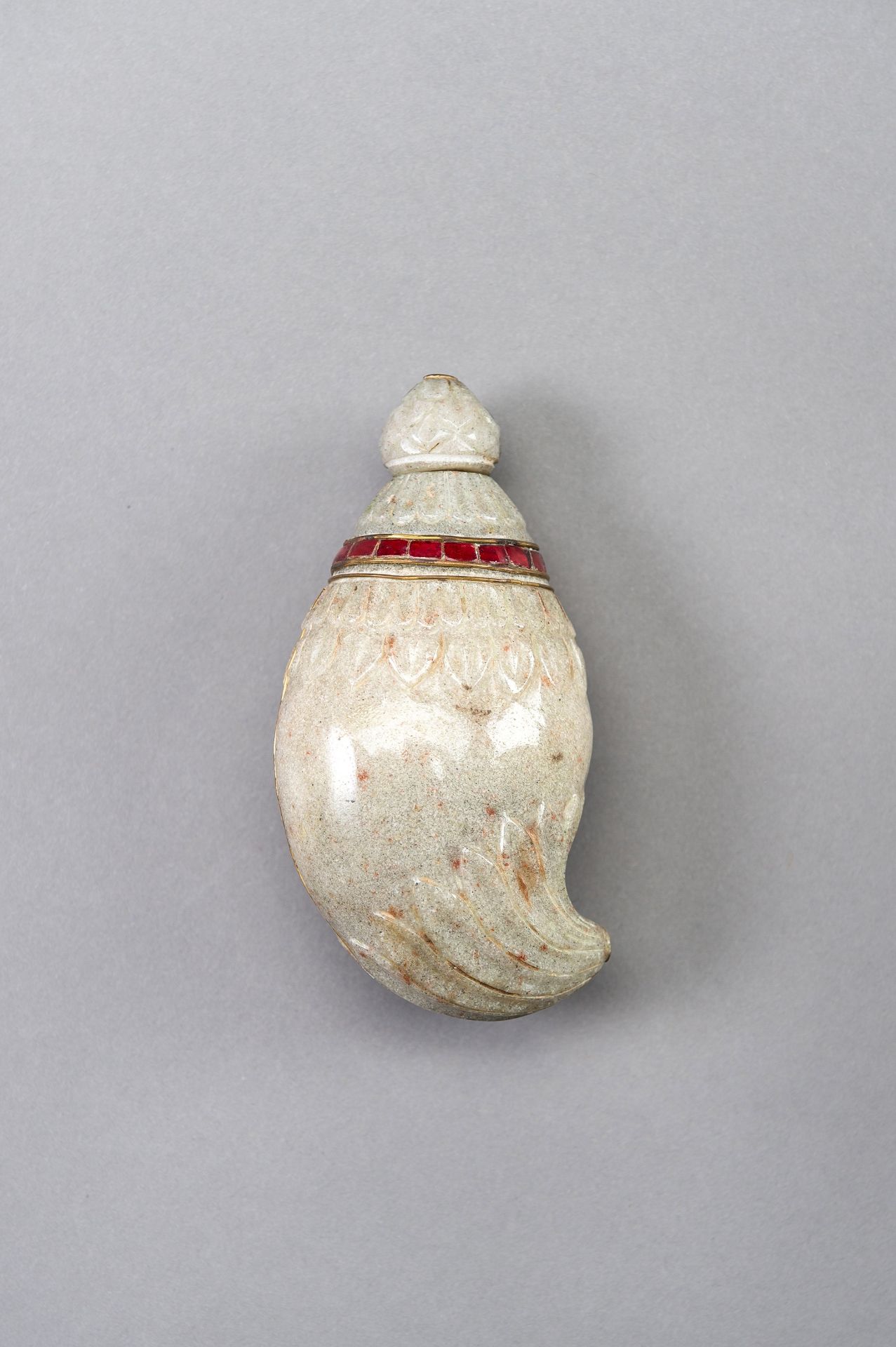 A MUGHAL-STYLE STONE PERFUME BOTTLE