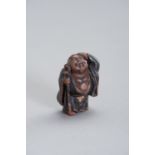 A FINE WOOD AND LACQUER NETSUKE OF HOTEI