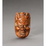 HOZAN: A WOOD NETSUKE OF EMMA-O