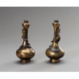 A PAIR OF PARCEL-GILT GARLIC HEAD VASES, 17TH CENTURY