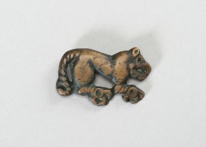 AN ORDOS BRONZE 'CROUCHING TIGER' PLAQUE, WARRING STATES