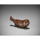 AN UNUSUAL WOOD NETSUKE OF A SWIMMING NINGYO (MERMAID)