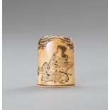 AN IVORY KISERUZUTSU CAP 'NETSUKE' DEPICTING A SAMURAI