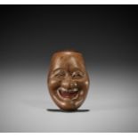 MANNEN: A WOOD MASK NETSUKE OF A KYOGEN MASK DEPICTING BIKUNI