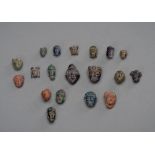 A GROUP OF 19 SMALL BACTRIAN HEADS