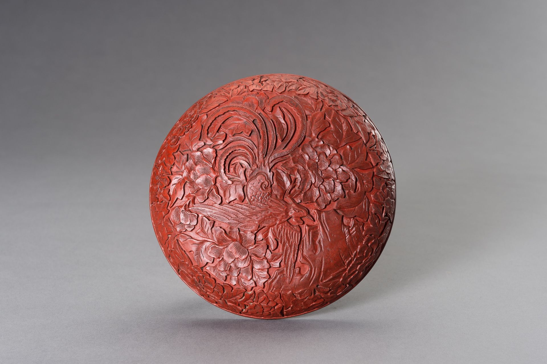 A RED LACQUER 'PHOENIX' BOX AND COVER