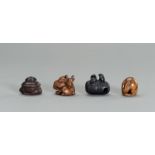 A GROUP OF FOUR WOOD NETSUKE OF ANIMALS