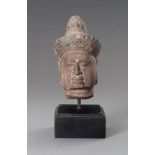 A STONEWARE MUSEUM COPY OF A KHMER HEAD