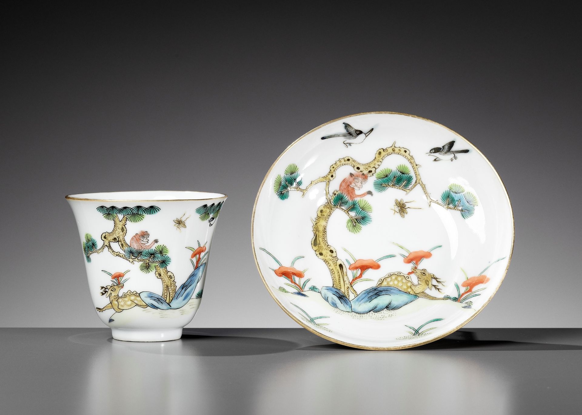 AN AUSPICIOUS 'MONKEY AND DEER' CUP AND SAUCER, XIANFENG MARK AND PERIOD