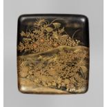 A BLACK AND GOLD LACQUER SUZURIBAKO WITH CHRYSANTHEMUM AND DUCKS