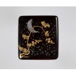 A BLACK AND GOLD LACQUER SUZURIBAKO WITH THE MOON, HO-O BIRDS AND KIRI MONS