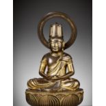 A RARE GILT BRONZE FIGURE OF DAINICHI NYORAI (MAHAVAIROCANA)