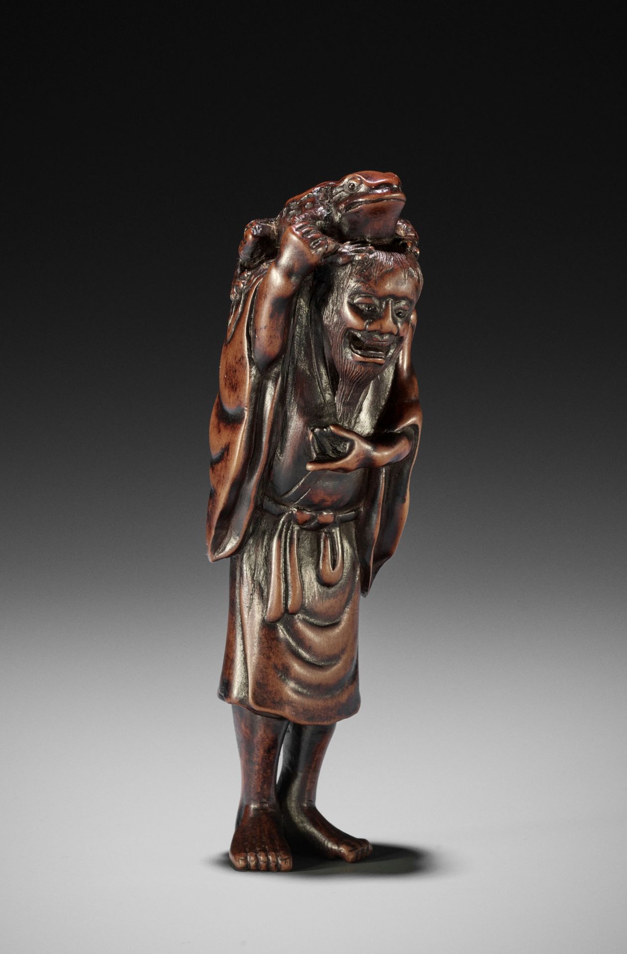 TADATOSHI: A LARGE WOOD NETSUKE OF GAMA SENNIN