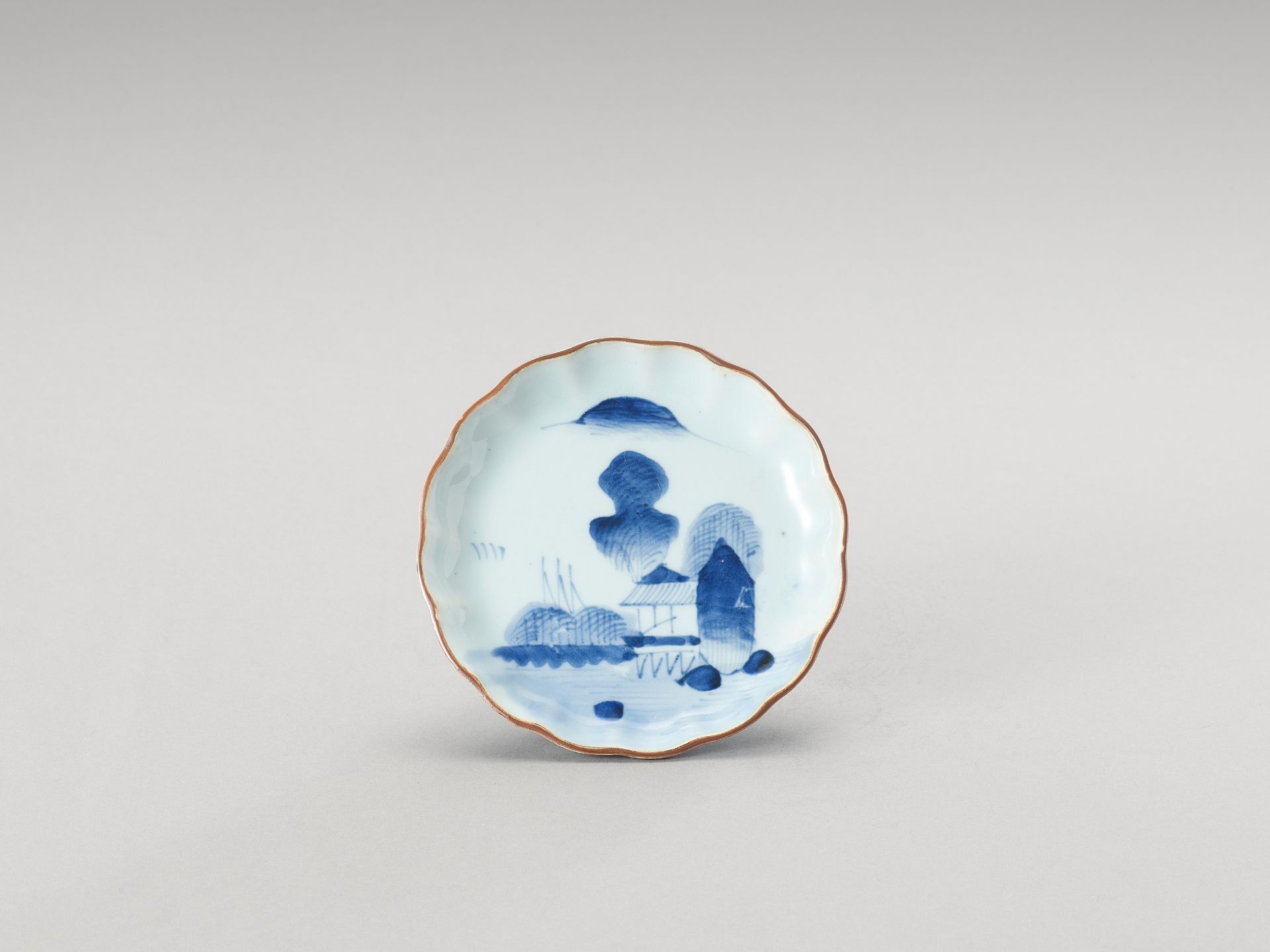 A SMALL BLUE AND WHITE LOBED PORCELAIN DISH