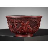 A RARE RED LACQUER 'MONGOL HUNT' BOWL, ATTRIBUTED TO ZHOU ZHU