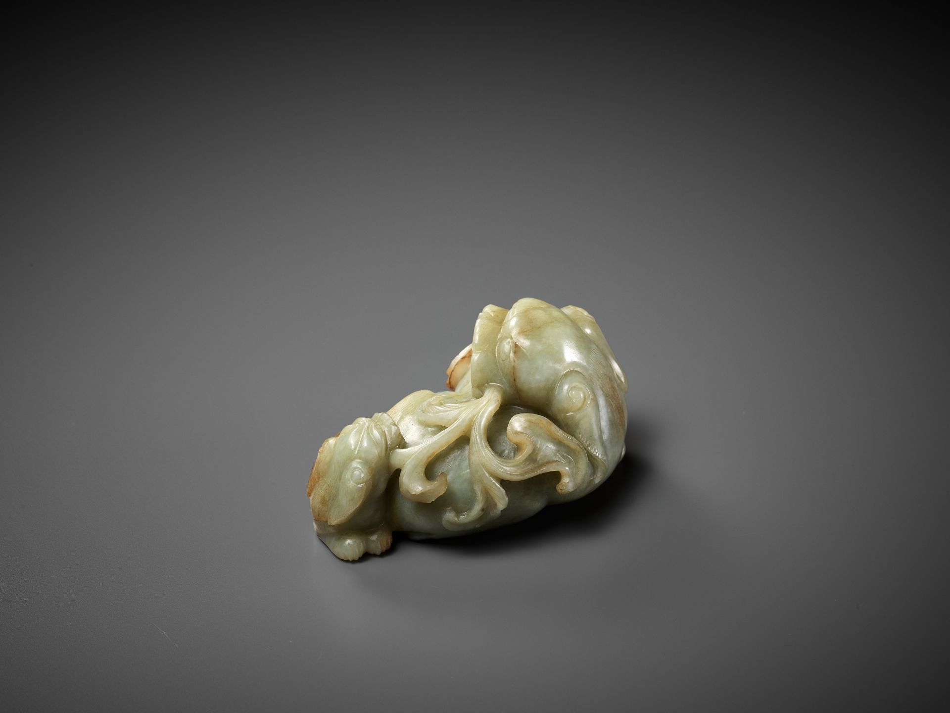 A CELADON AND RUSSET JADE 'BUDDHIST LION AND CUB' GROUP, 17TH CENTURY - Image 7 of 11