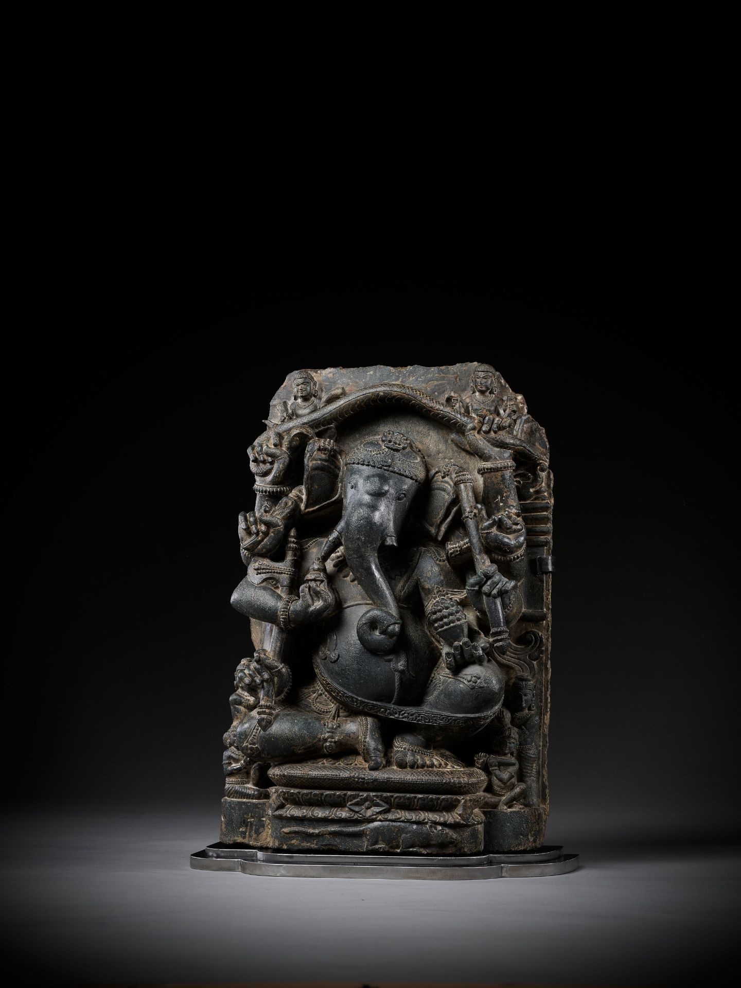 A BLACK SCHIST FIGURE OF GANESHA WITH A SNAKE MANDORLA, PALA PERIOD - Image 10 of 16