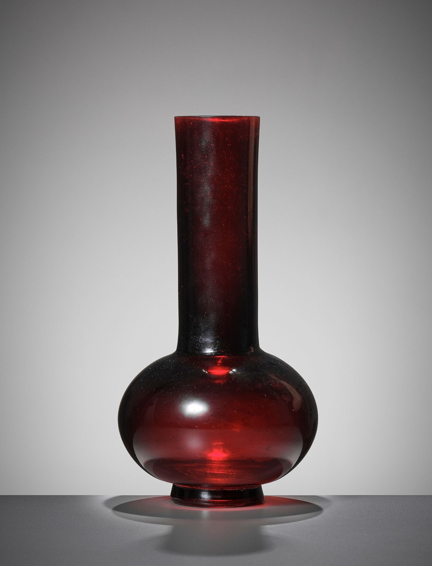 A RUBY-RED GLASS BOTTLE VASE, QIANLONG MARK AND PERIOD