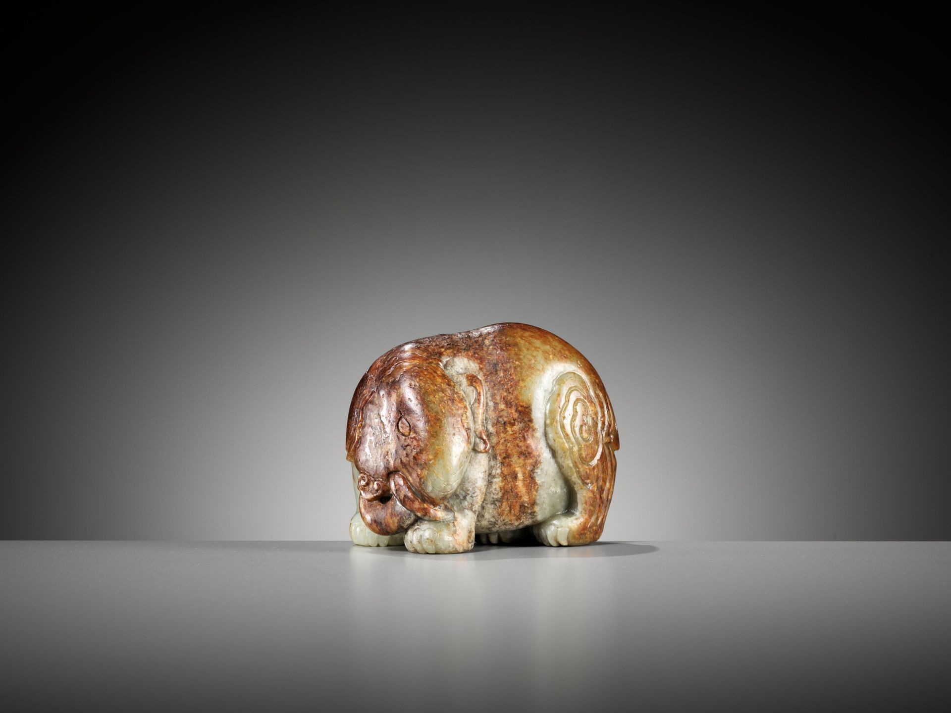 A CELADON AND RUSSET JADE FIGURE OF AN ELEPHANT, MING DYNASTY - Image 3 of 11