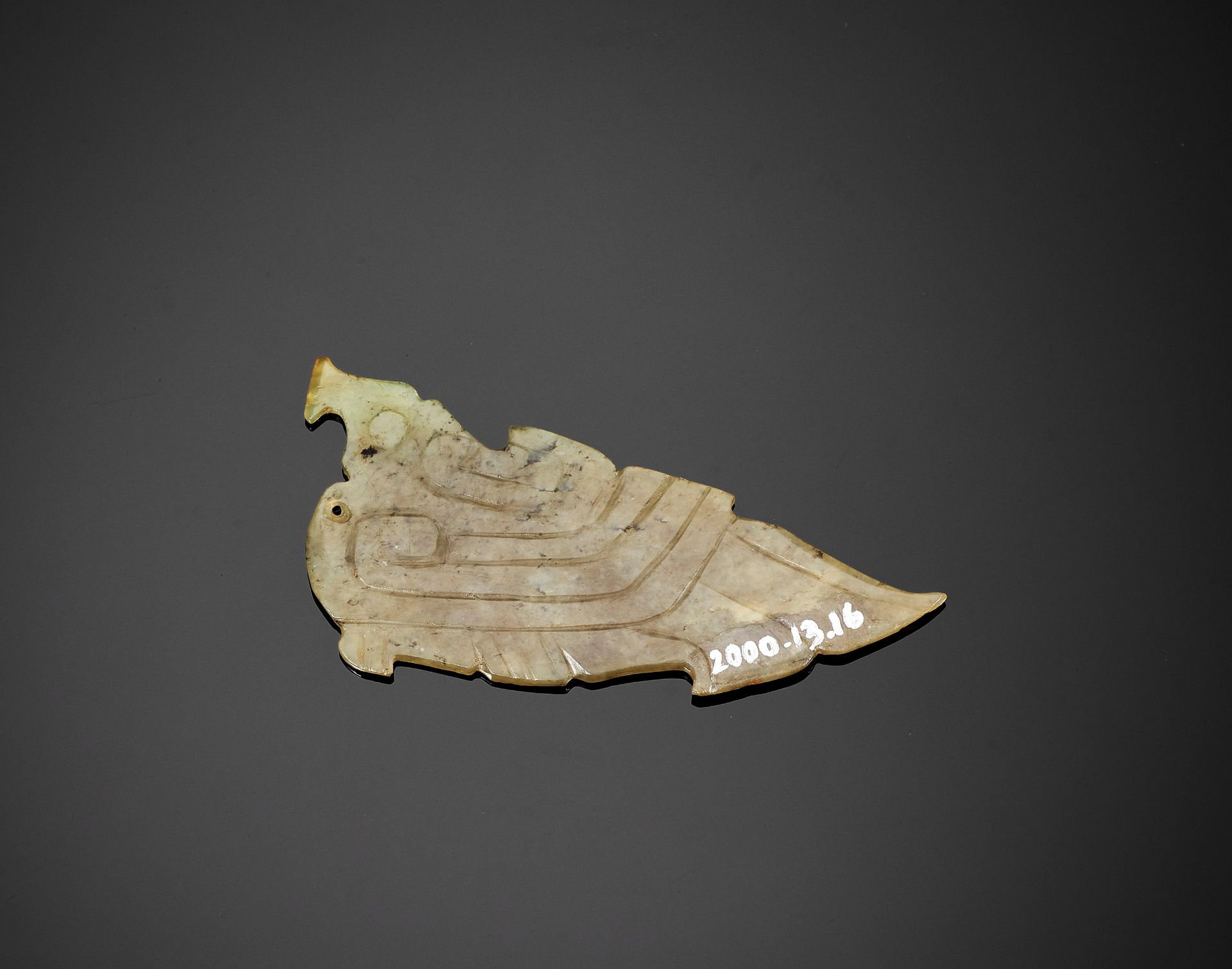 A CELADON JADE 'BIRD' PENDANT, MID-WESTERN ZHOU DYNASTY