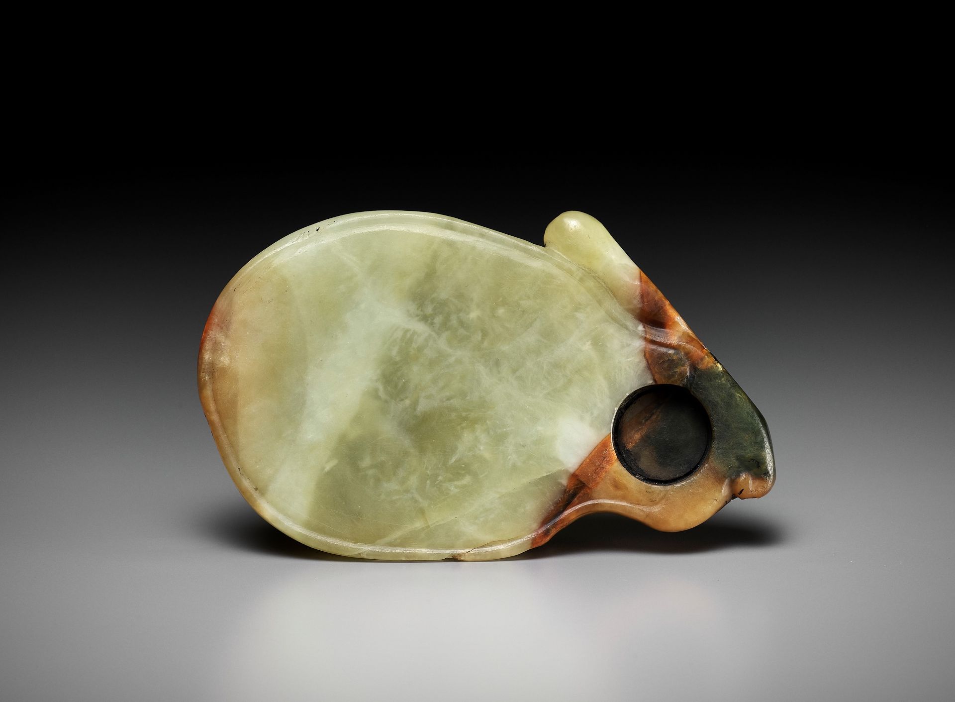 A YELLOW AND RUSSET JADE 'RABBIT' INKSTONE, EARLY QING DYNASTY