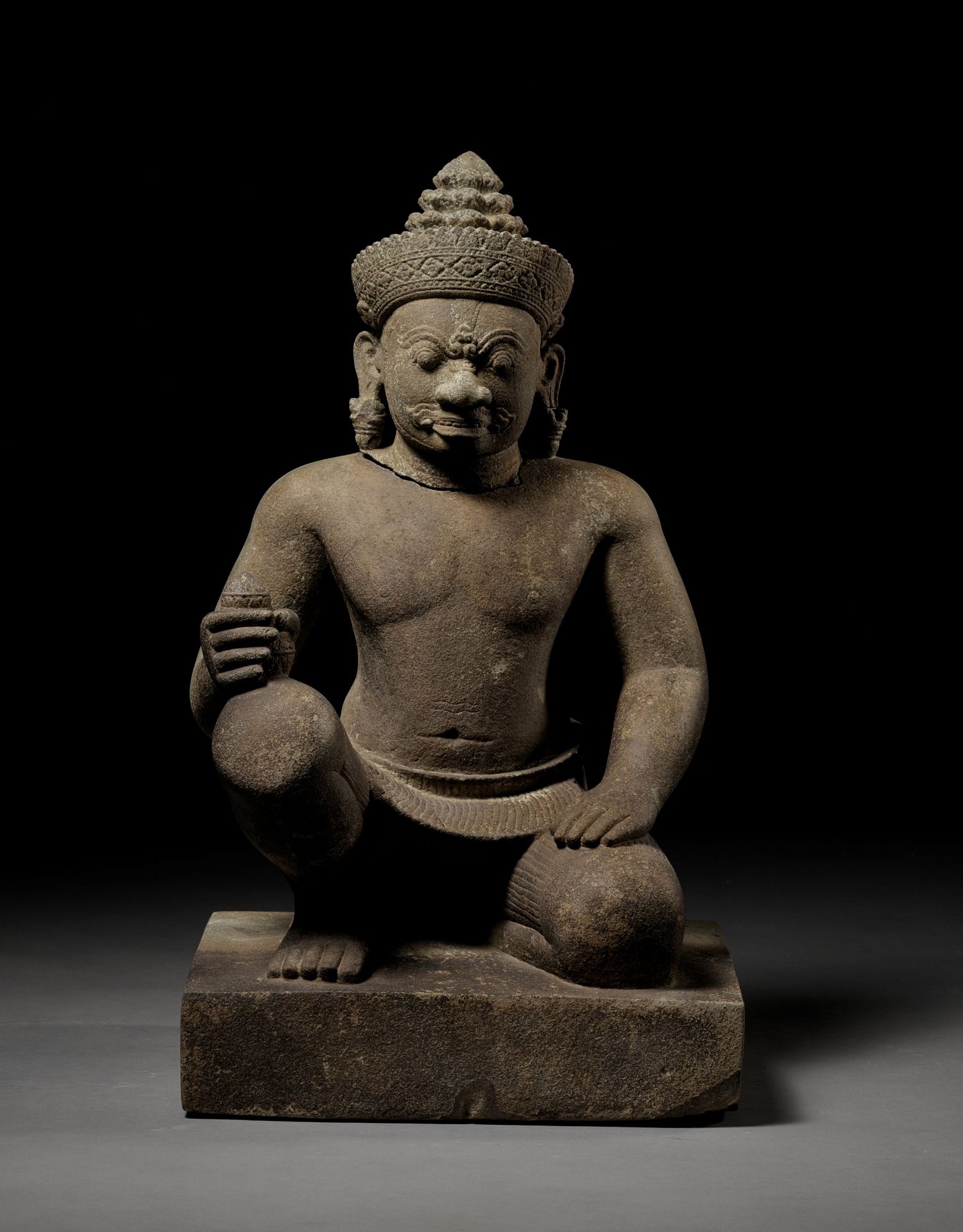 A SANDSTONE GUARDIAN FIGURE DEPICTING A YAKSHA, KOH KER STYLE