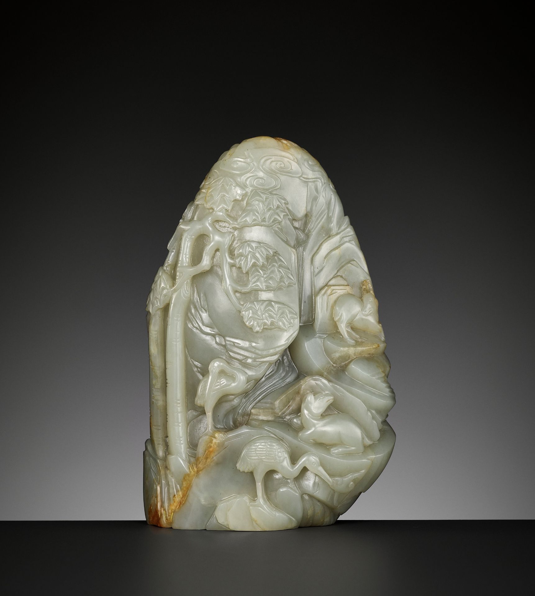 A CELADON AND RUSSET JADE 'DEER AND CRANE' BOULDER, 18TH CENTURY - Image 2 of 15