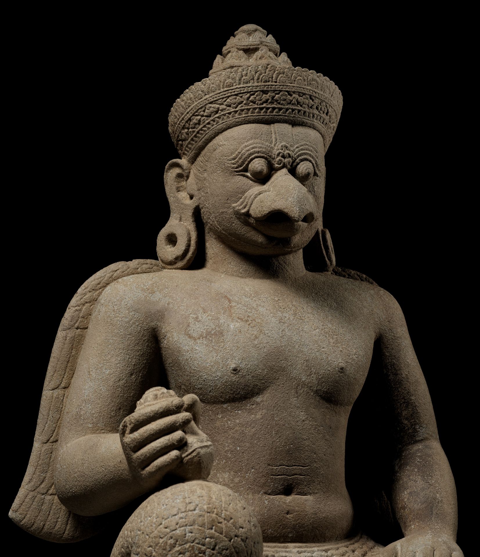 A SANDSTONE GUARDIAN FIGURE DEPICTING GARUDA, KOH KER STYLE