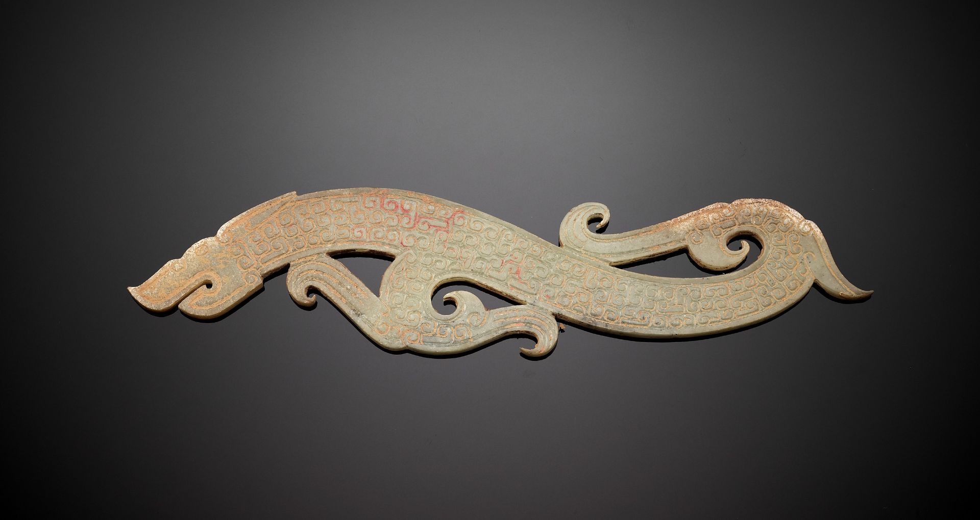 A LARGE CELADON JADE 'DRAGON' PENDANT, EASTERN ZHOU DYNASTY