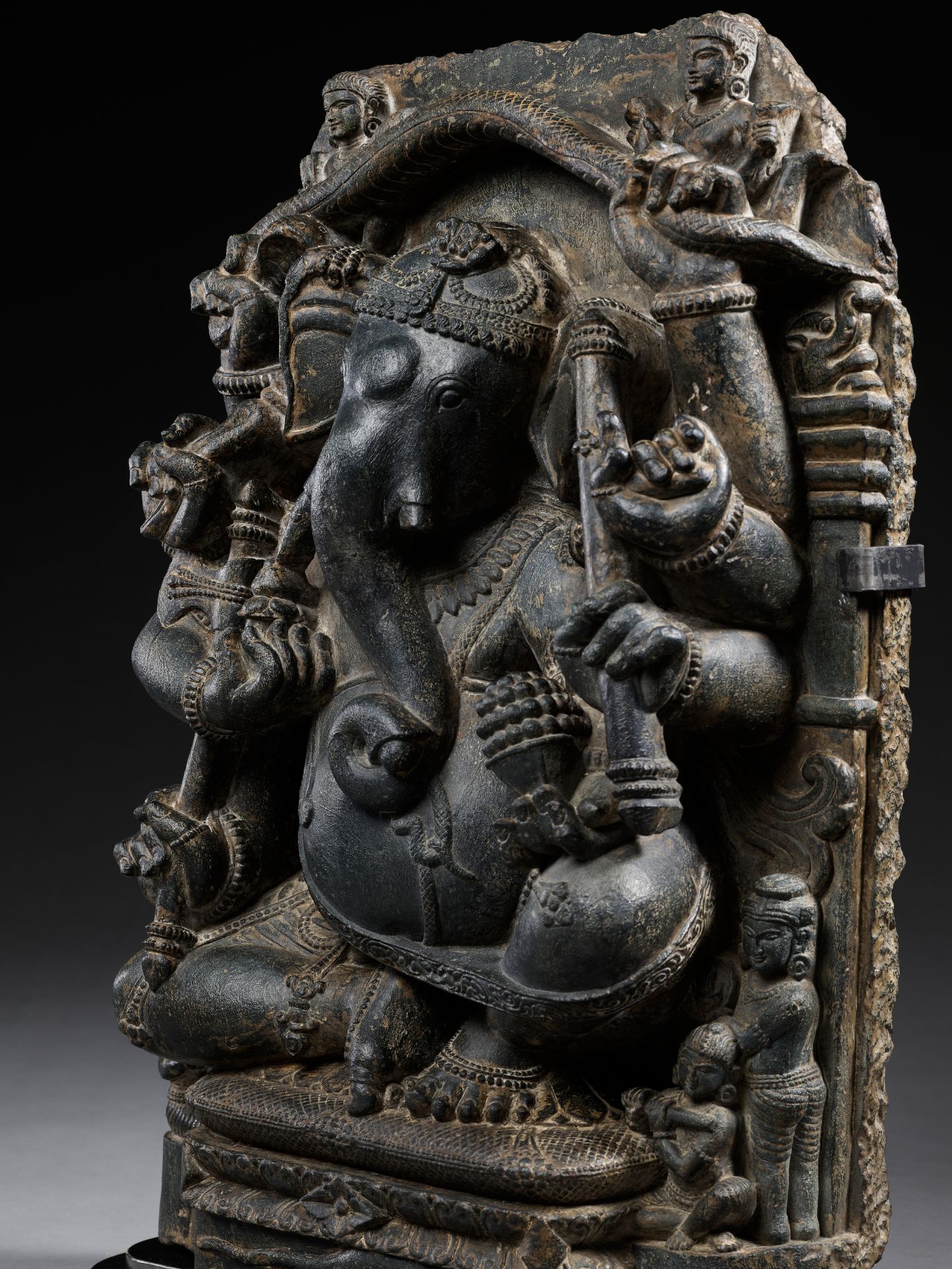 A BLACK SCHIST FIGURE OF GANESHA WITH A SNAKE MANDORLA, PALA PERIOD - Image 9 of 16