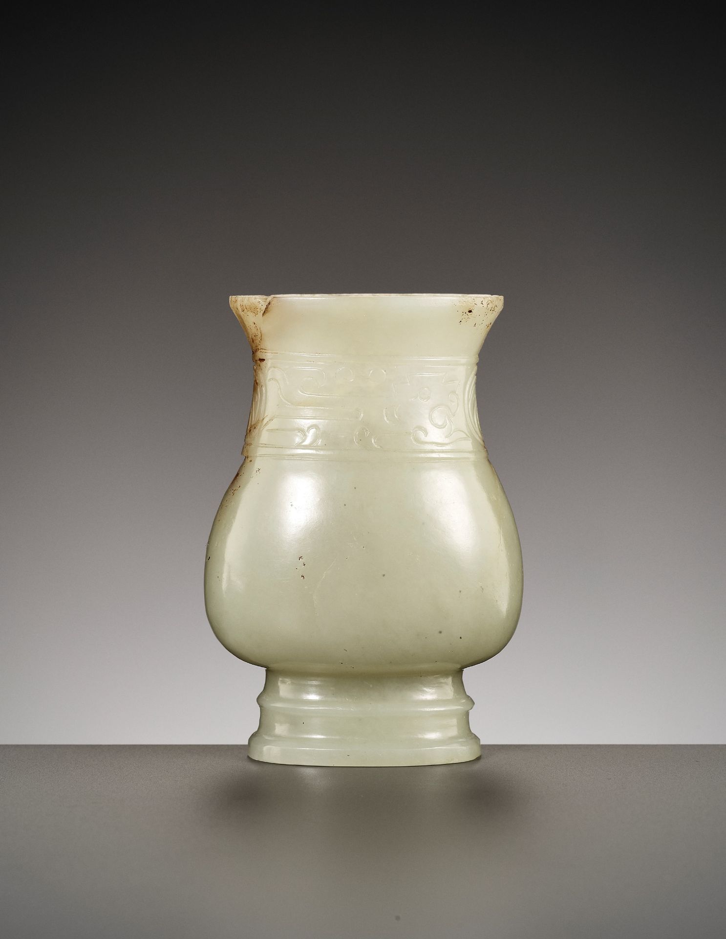 A RARE ARCHAISTIC 'SHANG BRONZE IMITATION' JADE VESSEL, ZHI, LATE SONG TO EARLY MING DYNASTY