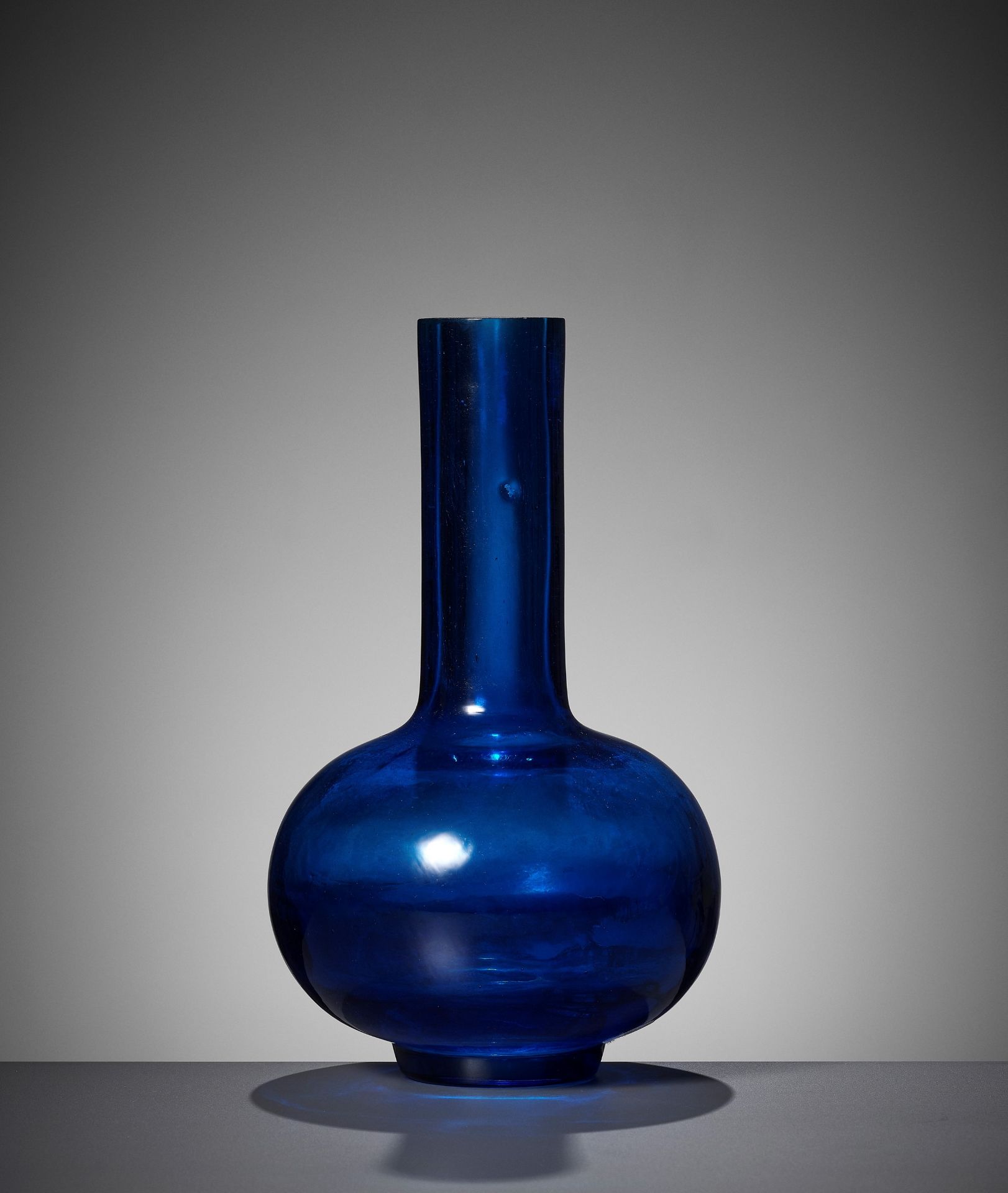 A RARE AQUAMARINE BLUE GLASS BOTTLE VASE, QIANLONG MARK AND PERIOD