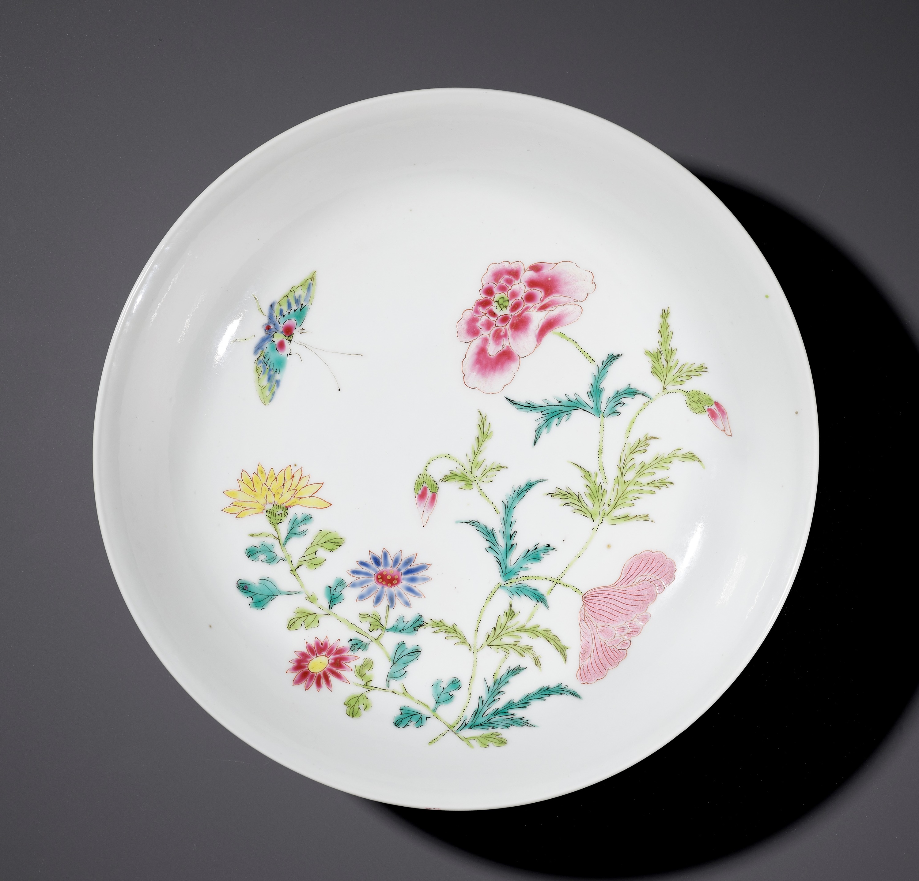 A FAMILLE ROSE 'BUTTERFLY AND FLOWERS' SAUCER DISH, YONGZHENG MARK AND PERIOD