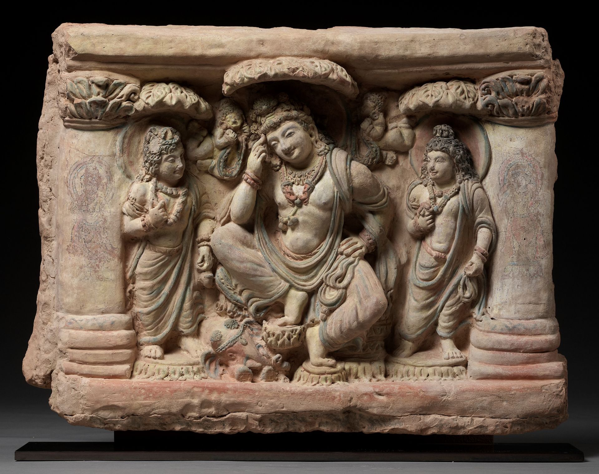 AN EXTRAORDINARILY RARE AND SPECTACULAR TERRACOTTA RELIEF OF A THINKING PRINCE SIDDHARTA UNDER THE B