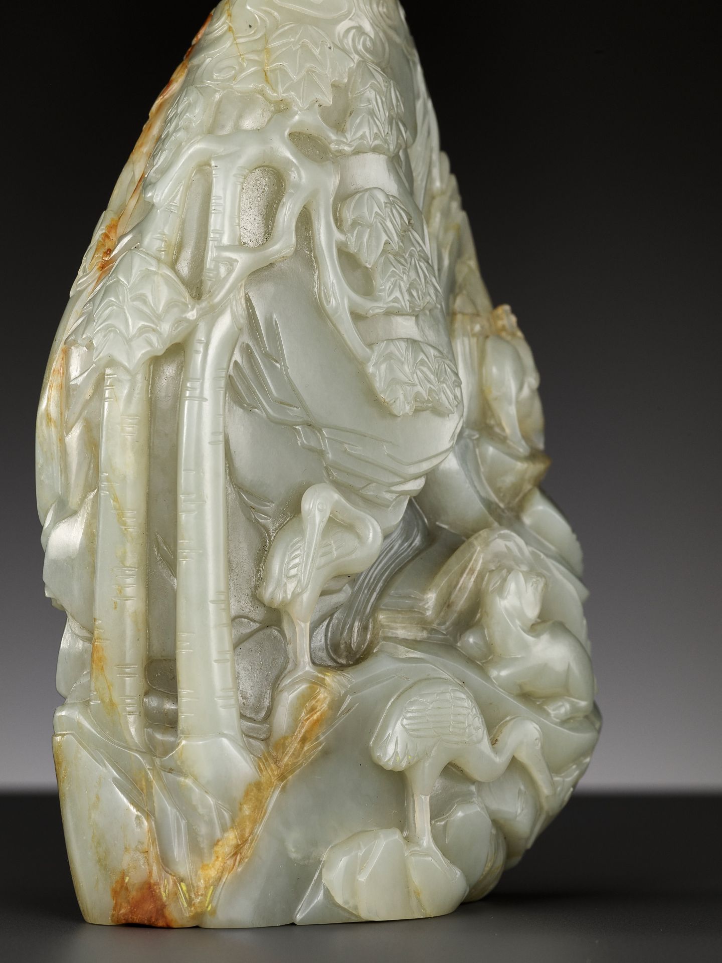 A CELADON AND RUSSET JADE 'DEER AND CRANE' BOULDER, 18TH CENTURY - Image 8 of 15