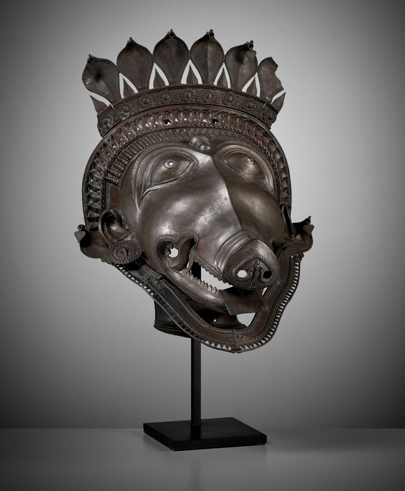 A LARGE BRONZE DANCER'S HEADPIECE IN THE FORM OF A PANJURLI BHUTA (BOAR SPIRIT DEITY)