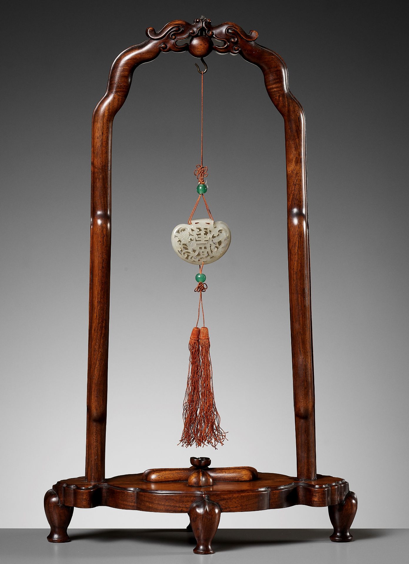 A WHITE JADE POMANDER AND MATCHING WOOD STAND, QIANLONG