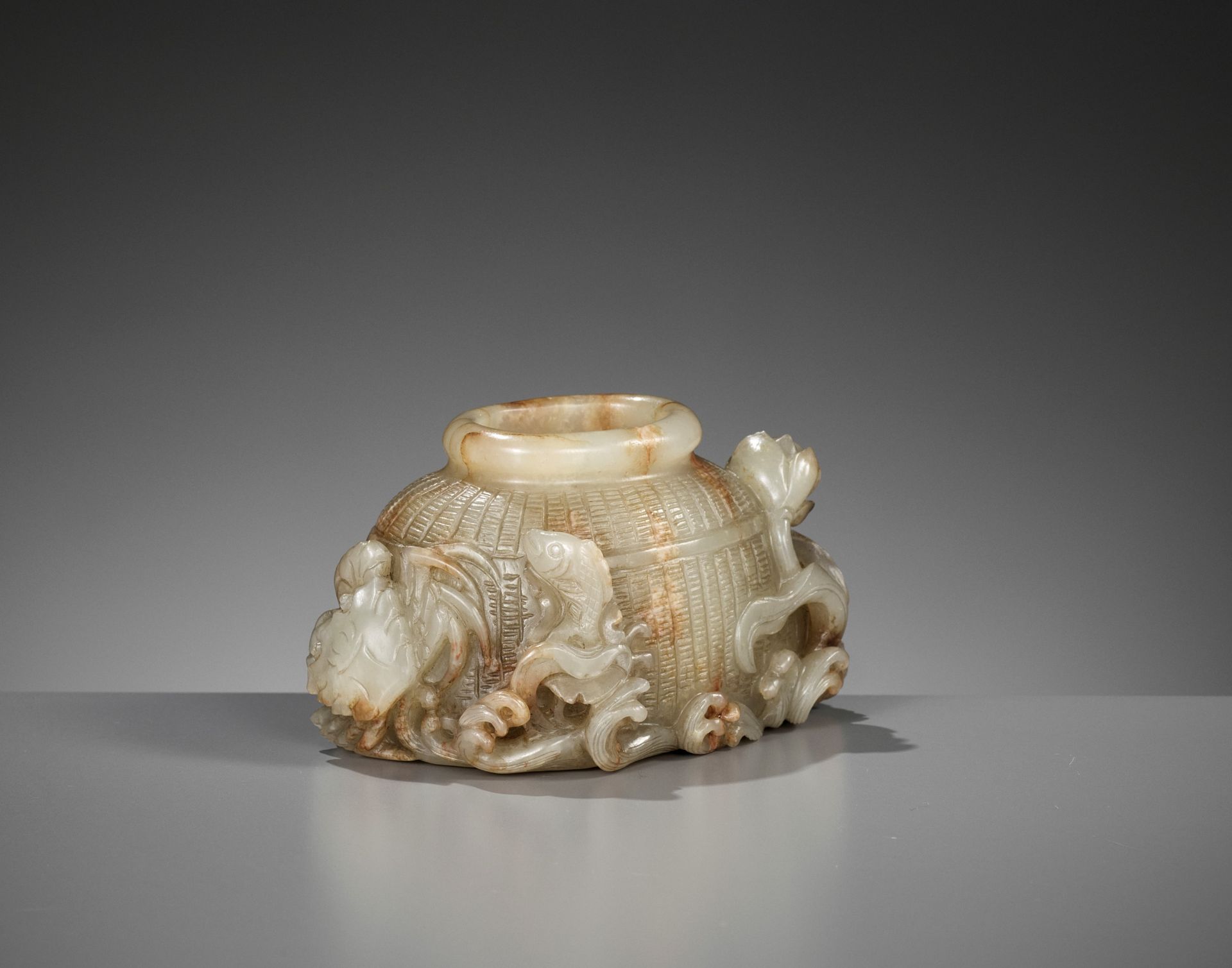 A FINE CELADON JADE 'FISH BASKET' BRUSH WASHER, 18TH-19TH CENTURY