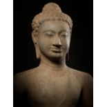 A MONUMENTAL AND HIGHLY IMPORTANT SANDSTONE FIGURE OF BUDDHA, PRE-ANGKOR PERIOD