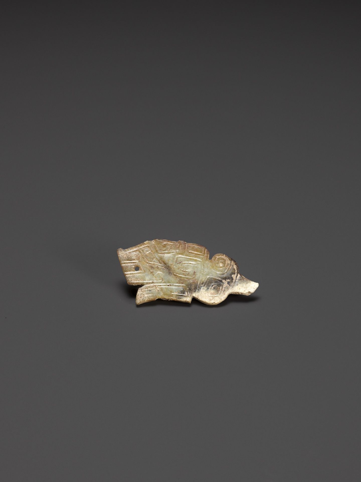 A TIGER-FORM JADE PENDANT, LATE SHANG DYNASTY - Image 2 of 10