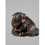 IKKAN: A FINE NAGOYA SCHOOL WOOD NETSUKE OF A RECUMBENT HORSE