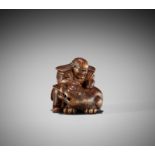 MASAKATA: A FINE AND RARE WOOD NETSUKE OF HADESU SLAYING THE TIGER