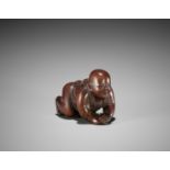 A YAMADA SCHOOL WOOD NETSUKE OF A BABY BOY, ATTRIBUTED TO MASAKATSU